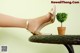 A woman's feet in high heels on a table.