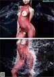 A woman in a red fishnet bodysuit is splashing in the water.